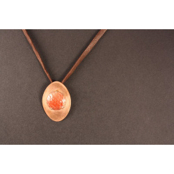 red enamelled disc in oval copper setting