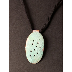 Pierced  and enamelled copper oval 